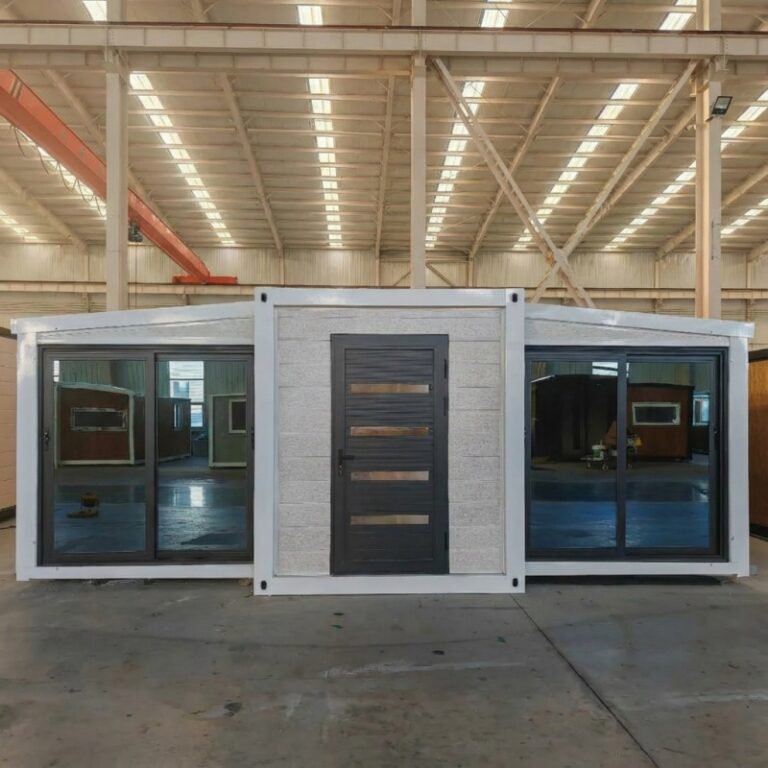 Expandable container home with large sliding glass doors and a stylish exterior, manufactured by a China container house factory. Designed for flexibility and easy transportation for residential or commercial use.