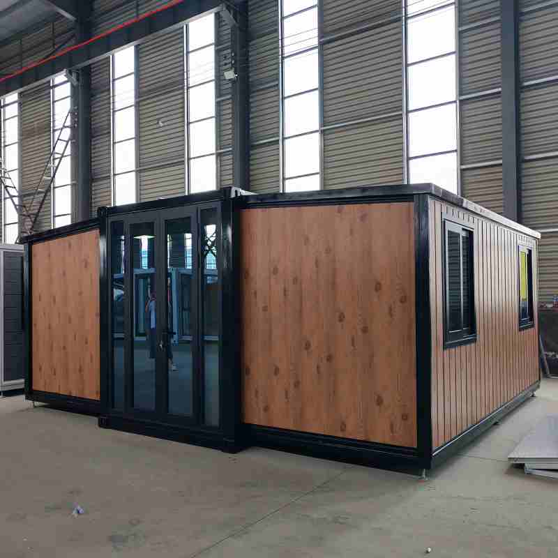 Interior of expanded 40ft expandable prefab house showing open living kitchen area, premium China expandable container house factory production